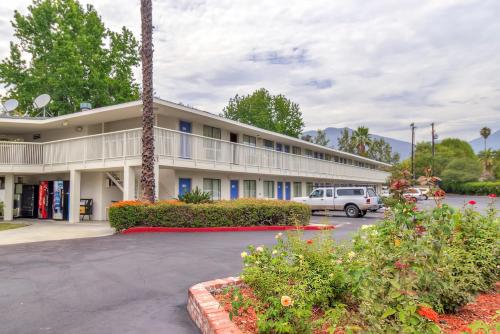 a hotel with a car parked in a parking lot at Motel 6-Arcadia, CA - Los Angeles - Pasadena Area in Arcadia