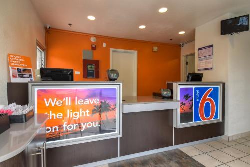a waiting room with a tv and a counter at Motel 6-Arcadia, CA - Los Angeles - Pasadena Area in Arcadia