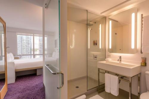 a bathroom with a sink, toilet, and bathtub at YOTEL New York Times Square in New York