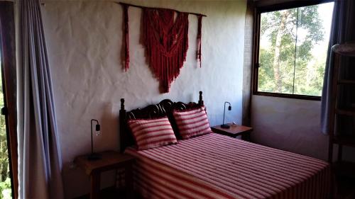 Un pat sau paturi într-o cameră la Villa do Sol
