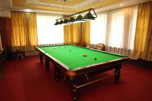 a pool table with balls on it in a room at Guide Hotel in Ulaanbaatar