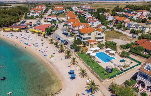 an aerial view of a resort with a beach at Nice Apartment In Povljana With Kitchen in Povljana
