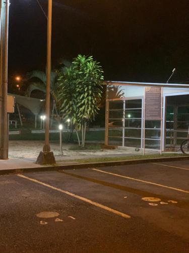 an empty street in front of a building at night at Apartamento amoblado nuevo in Pereira