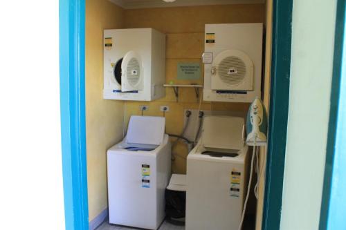 a room with refrigerators and other appliances in it at Glenmore Palms Motel in Rockhampton
