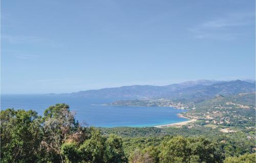 a view of a body of water from a hill at Stunning Apartment In Calcatoggio in Calcatoggio