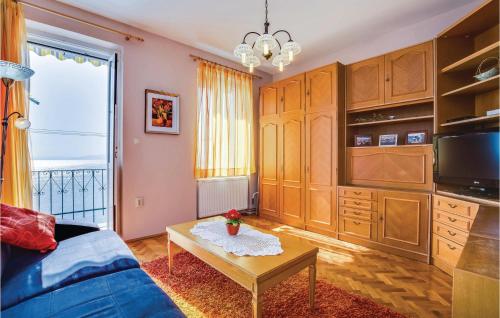 a living room with a couch and a table at Gorgeous Apartment In Rijeka With Kitchen in Rijeka