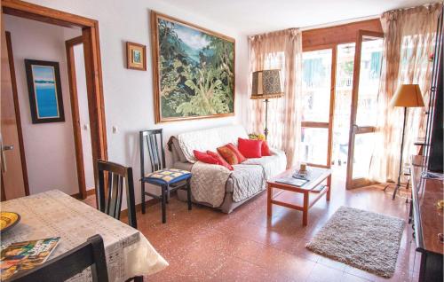a living room with a couch and a table at Stunning Apartment In Pineda De Mar in Pineda de Mar
