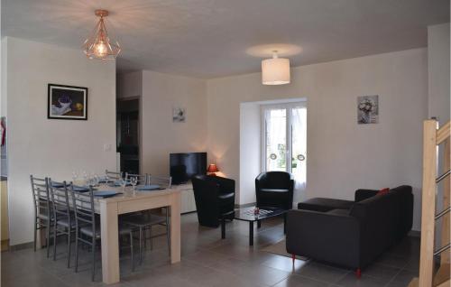 a living room with a dining room table and chairs at Pet Friendly Home In Saint Alban in Saint-Alban