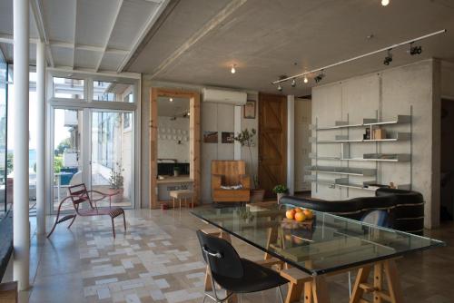 a living room with a glass table and chairs at City Centre Studios in Limassol