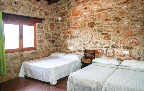 Ένα ή περισσότερα κρεβάτια σε δωμάτιο στο 6 Bedroom Awesome Home In La Salzadella