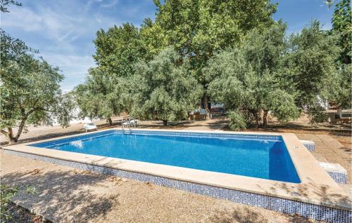 una piscina en un patio con árboles en 6 Bedroom Gorgeous Home In Riudoms, en Riudoms