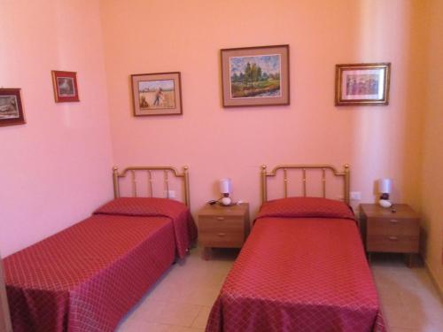 Posteľ alebo postele v izbe v ubytovaní B&B Regina Margherita
