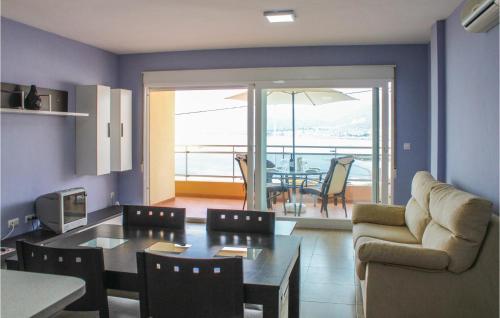a living room with a table and a couch at Amazing Apartment In La Azohía in La Azohía