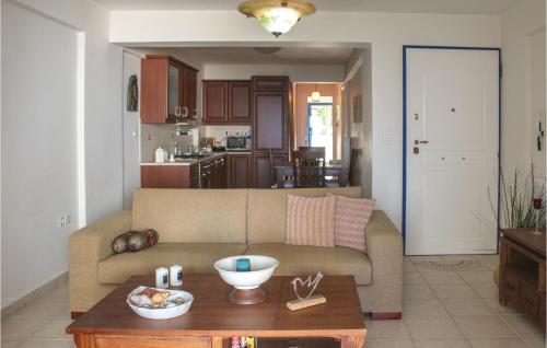a living room with a couch and a table at Awesome Apartment In Melissi Korinthia in Dhiminión