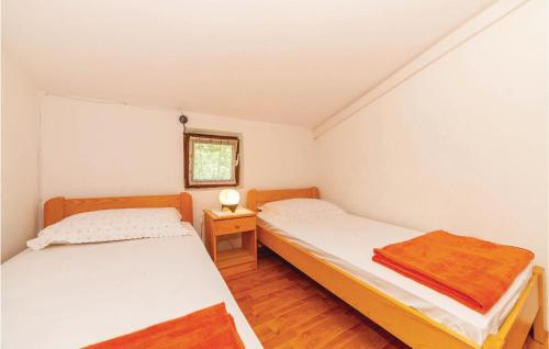 Кровать или кровати в номере 2 Bedroom Amazing Apartment In Crikvenica