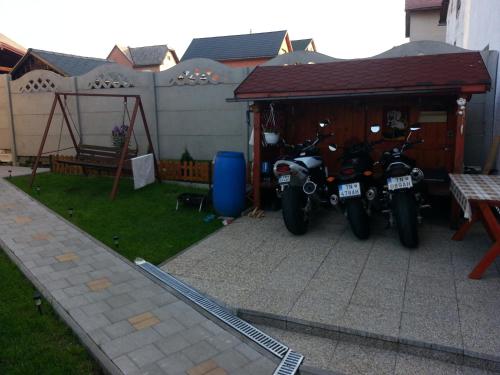 a couple of motorcycles parked in a garage at Ubytovanie u Vlasty in Štrba