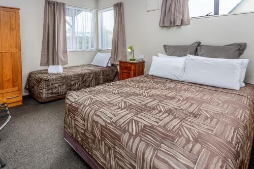 En eller flere senge i et værelse på 10 Cottages