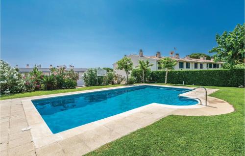 a swimming pool in the yard of a house at Nice Home In Sant Feliu De Guíxols in Sant Feliu de Guixols