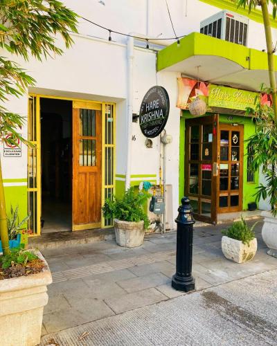 a store with a sign on the front of a building at Barrio Antiguo Hostel HK in Monterrey