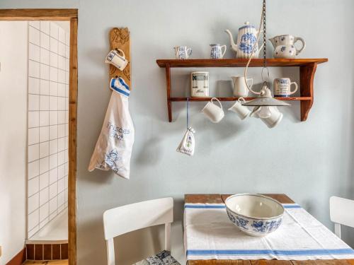 a kitchen with a table with a bowl on a table at Escape Near River, Wolfsberg in Wolfsberg