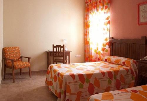 Postel nebo postele na pokoji v ubytování Hotel Rural Miguel Angel