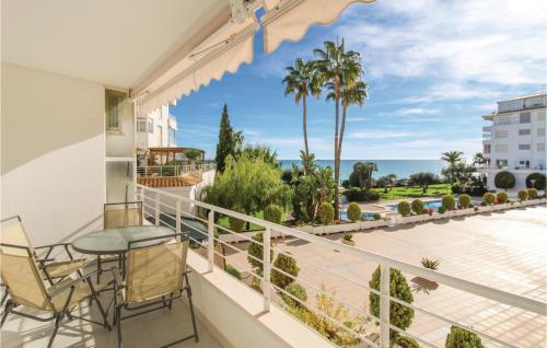 a balcony with a table and chairs and a view of the ocean at Awesome Apartment In Altea With Wifi in Altea