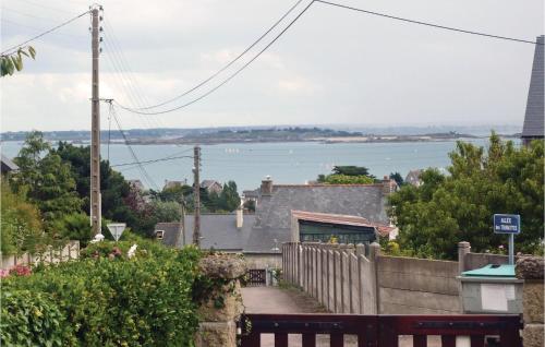 a view of the water from a house at Two-Bedroom Holiday Home In Saint Cast Le Guildo in LʼIsle-Saint-Cast