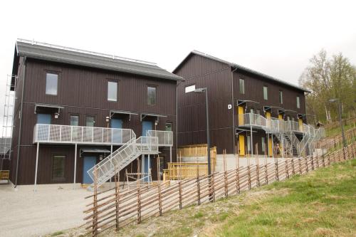 a building with a staircase in front of it at Funäs Ski Lodge in Funäsdalen