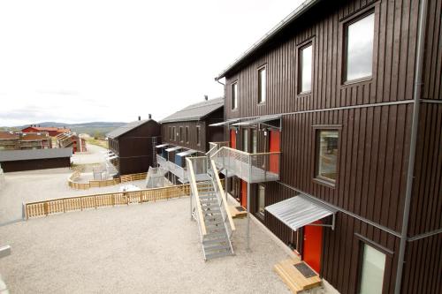 a building with a staircase on the side of it at Funäs Ski Lodge in Funäsdalen