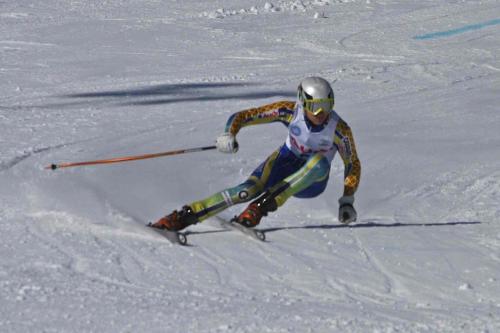 a man is skiing down a snow covered slope at Funäs Ski Lodge in Funäsdalen