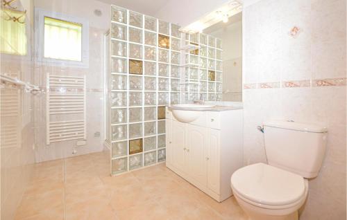 a white bathroom with a toilet and a sink at Nice Home In Casalabriva With Wifi in Casalabriva