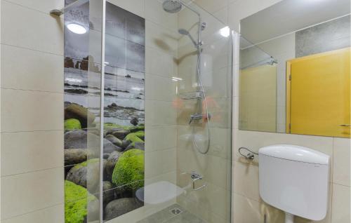a bathroom with a shower and a toilet at 2 Bedroom Beautiful Apartment In Pag in Pag