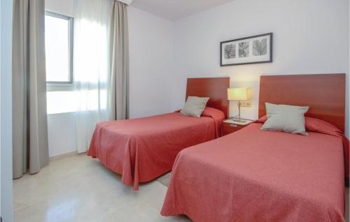 Кровать или кровати в номере 2 Bedroom Cozy Home In Mijas Costa
