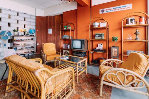 a living room filled with furniture and a tv at Walk-Up To SIAR - Children Not Allowed in Cameron Highlands