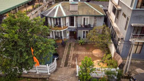an aerial view of a house with a white fence at Ella moon rock in Ella