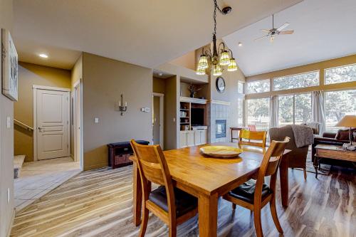 a dining room and living room with a table and chairs at Eagle Crest Highland Getaway in Redmond