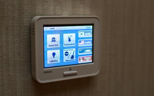 an apple ipod is attached to a wall at Harmony Hotel in Seoul