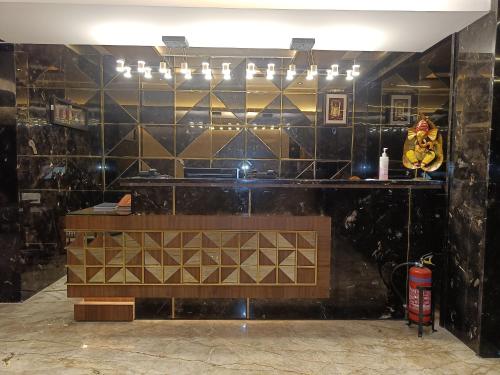 a counter in a room with a tile wall at The Kings Park Grand-Near US Consulate in Chennai