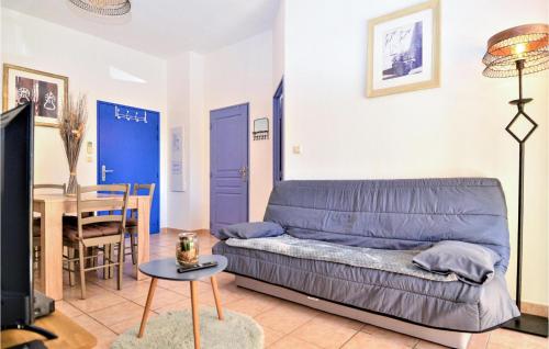 a living room with a couch and a table at 2 Bedroom Amazing Apartment In Uzes in Uzès