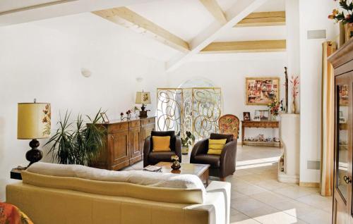 a living room with two couches and a table at Awesome Home In Toulon in Toulon