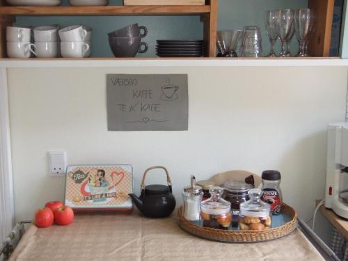 a kitchen counter with a tray of food on it at Nattely I Viborg By in Viborg