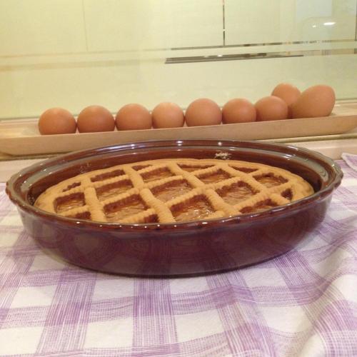 a waffle in a pan on a table with eggs at Hotel Vienna in Milan