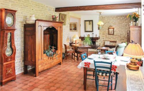 a living room with a table and chairs in it at Holiday Home Rue De Kroas Prenn in La Forêt-Fouesnant