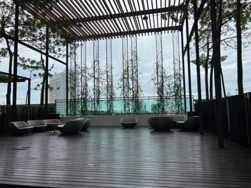a lobby with a row of chairs and a large window at The Shore Melaka in Melaka