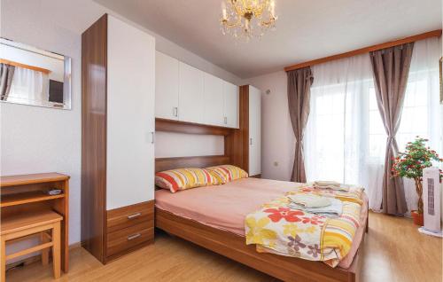 A bed or beds in a room at Nice Apartment In Crikvenica With Kitchen