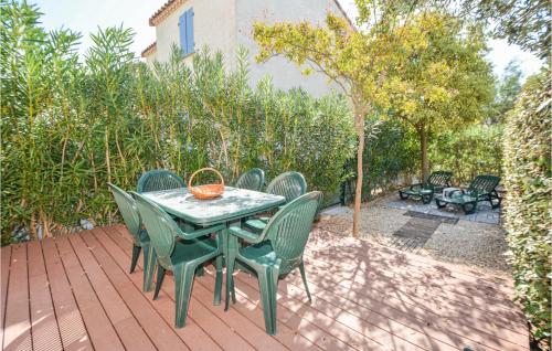 a table and chairs sitting on a patio at 3 Bedroom Awesome Home In Aigues-Mortes in Aigues-Mortes