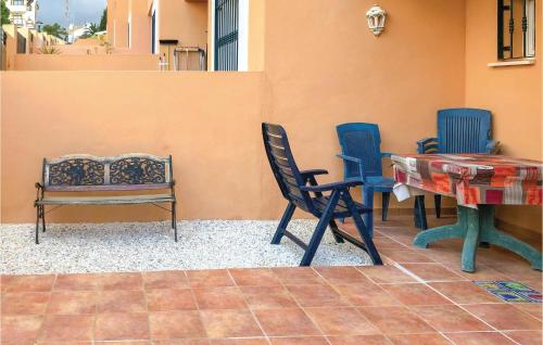 a room with chairs and a table and a bench at Jarales Alpha in Mijas Costa