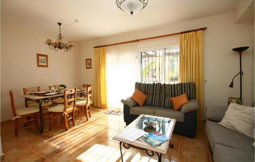a living room with a couch and a table at Jarales Alpha in Mijas Costa