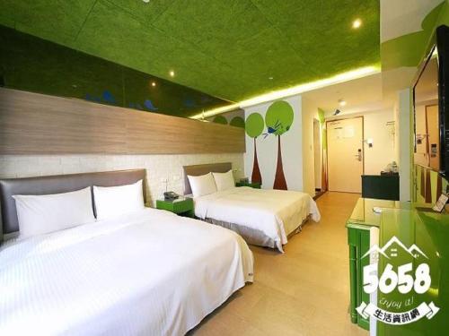 Postel nebo postele na pokoji v ubytování R8 Eco Hotel