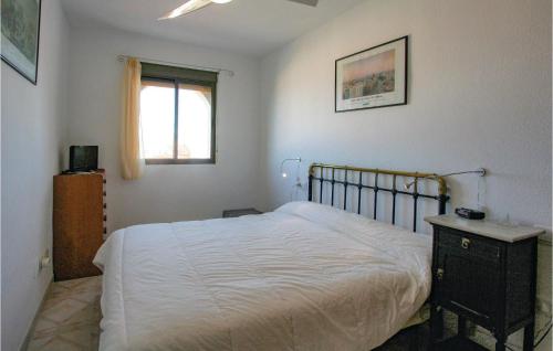 A bed or beds in a room at 2 Bedroom Stunning Home In Santa Pola